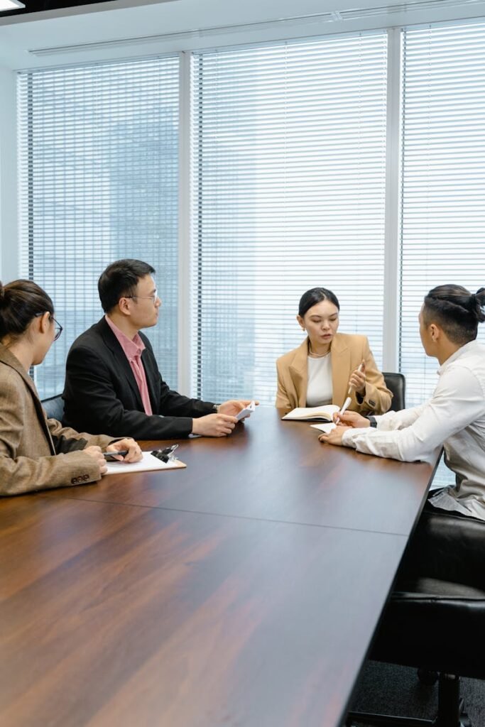 Group of colleagues collaborating in a modern office setting.